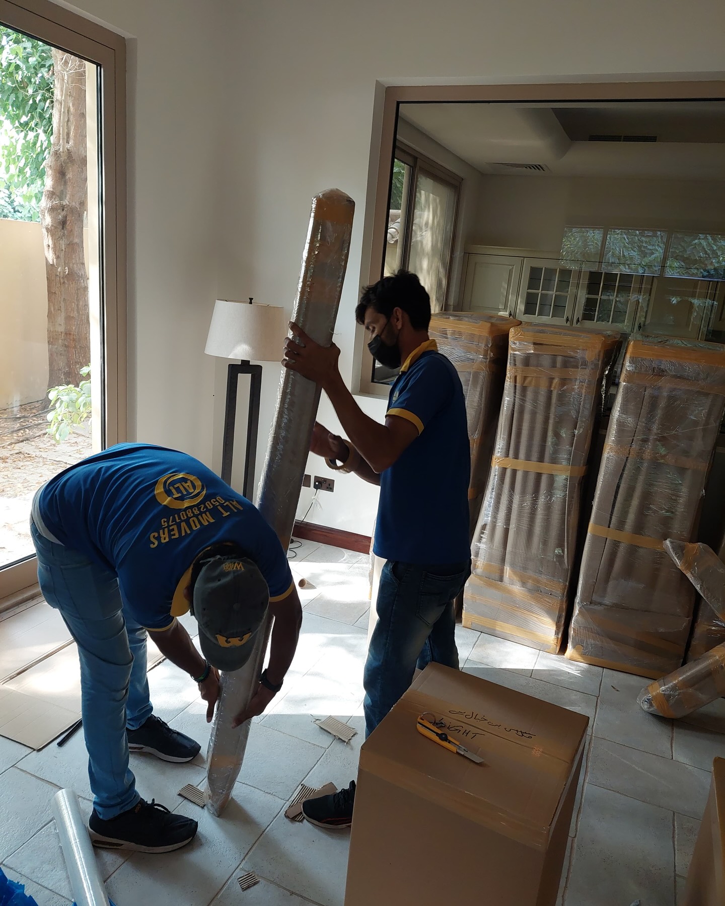 ALT Movers Dubai team preparing furniture for relocation